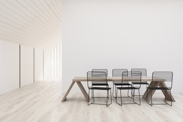 White kitchen with a wooden table