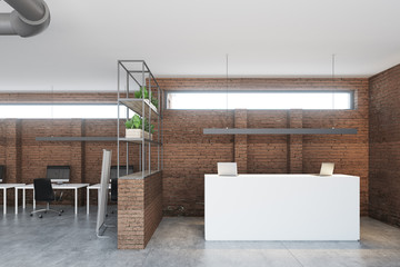 Brick office, white reception desk