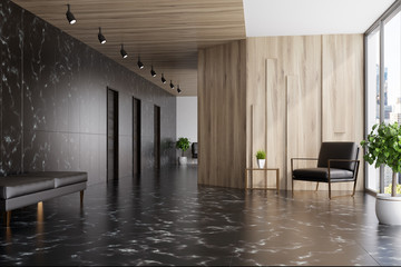 Black marble and wooden elevator hall, armchair © ImageFlow
