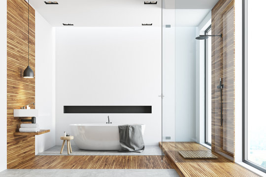 Wooden and white bathroom, round tub