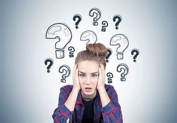 Stressed teen girl, question marks