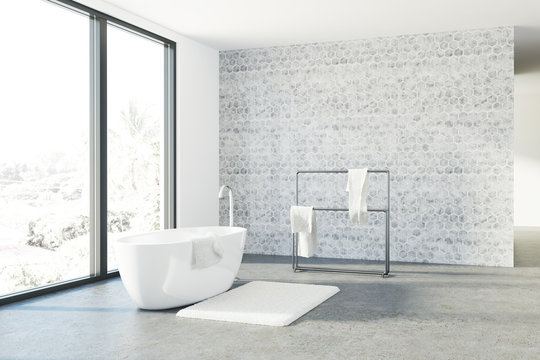 Concrete bathroom, white tub, loft