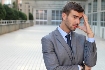 Businessman deep in thoughts close up with copy space