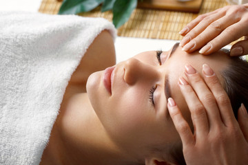 Massage and body care. Spa body massage treatment. Girl having massage in the spa salon.Woman Skin...