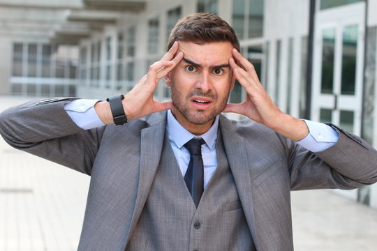 Businessman showing fear and stress close up