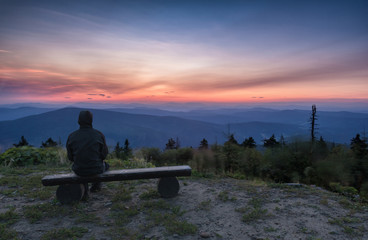 Man who is watching Sunrise on Lysa hora, Lysa peak, With cottage, Beskydy mountain range, Czech...