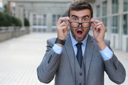 Surprised man with glasses close up