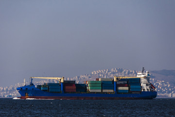 Boat full of containers on the sea in Izmir