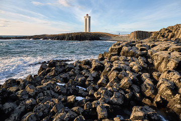 Fototapeta na wymiar Light lighthouse on promontory