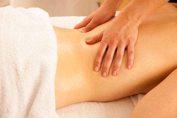 Body care. Spa body massage treatment. Woman having massage in the spa salon