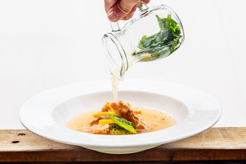 Fish soup with salmon and clear broth.