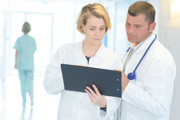 doctors looking at a record