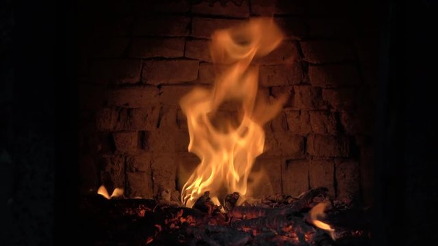 Video of a fire burning wood in a pizza oven
