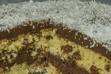 Coconut chocolate cake on blue dish