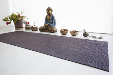 Singing bowls, om tingsha cymbals and yoga mat