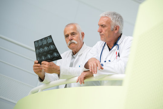 two doctors looking at x-ray