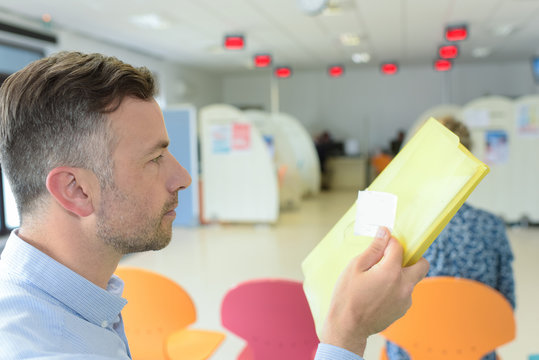 Male Patient Waiting In Hospital Lobby