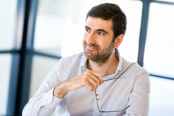 Naklejka premium Pensive businessman at office