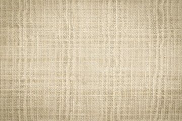 Old jute hessian sackcloth canvas sack cloth woven texture pattern background in aged yellow beige...
