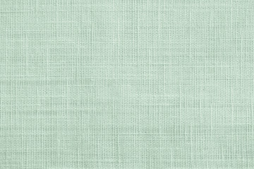 Jute hessian sackcloth canvas sack cloth woven texture pattern background in pastel light green color