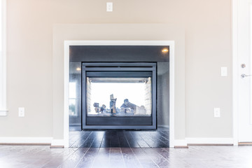 Modern two sided fireplace coming outside, outdoors on loft in model house, home or apartment with balcony