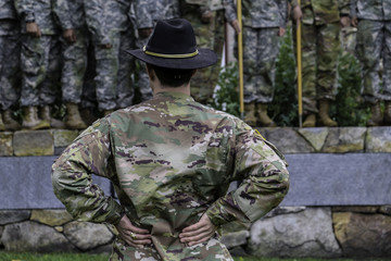 Commander standing from of soldiers