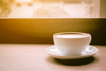 Coffee cup on table at cafe.