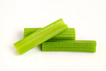 Fresh celery stalks on a white isolated background