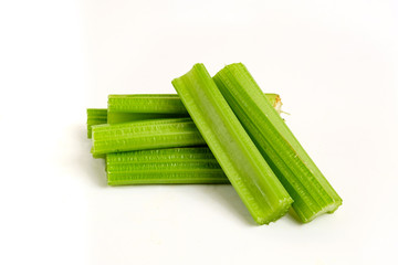 Fresh celery stalks on a white isolated background