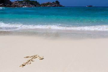 drawing arrow on sand