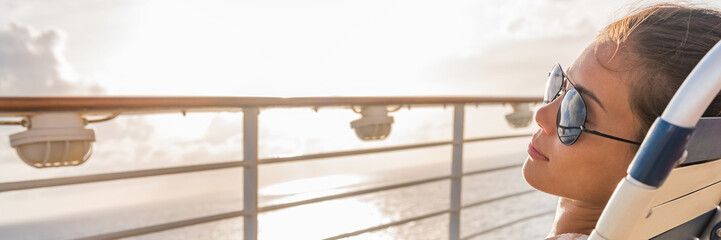 Cruise ship vacation travel woman relaxing panoramic crop. Banner of girl with sunglasses lying...