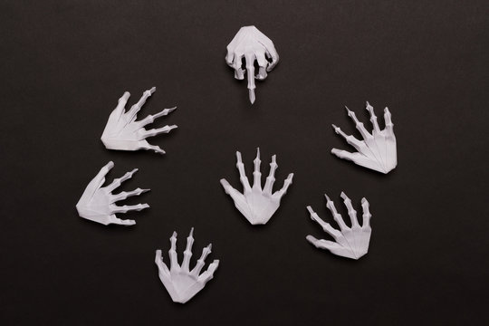 Black Halloween Background with White Skeleton Hands