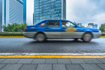 Blurred taxi on the road in the city of shanghai