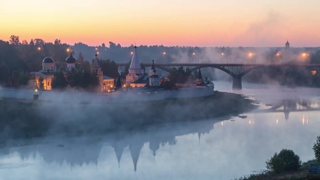 Fog swirls over the Volga river beside of Staritskiy Holy Dormition Monastery in Staritsa, Tverskaya oblast, Russia
