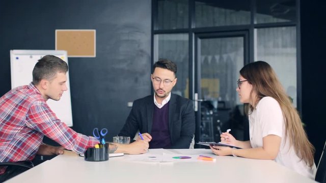 Team brainstorming process. coworkers discussing new ideas modern office