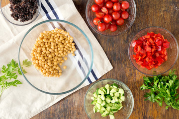 Ingredients for cooking vegetarian salad with chickpeas, black quinoa, vegetables