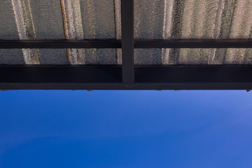Metal roof sheet with clear blue sky