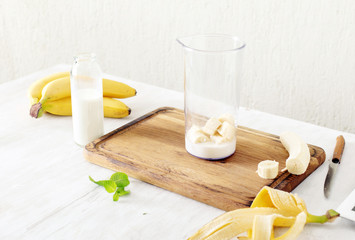 Ingredients for banana milkshake in home kitchen