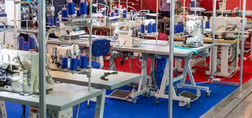 Fototapeta na wymiar Sewing factory, nobody, overlock machines