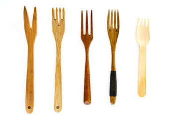 Wooden forks on white background