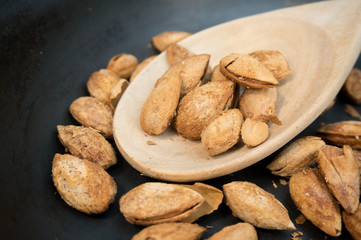 Almonds in wood spoon