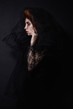 Woman In Black Veil With A Bloody Face.halloween