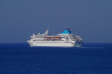 Celestyal Cruises modern cruise ship or cruiseship liner in the sun light against blue sea ocean...