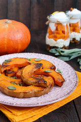 Pieces of pumpkin baked with herbs. Thanksgiving dish.