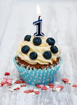 Cupcake with a numeral one candle