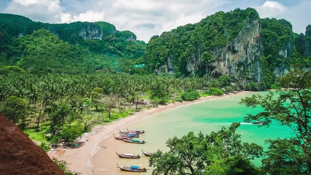 Hat Tom Sai Beach with long tail boats on the beach. Railay travel destination near Ao Nang, Krabi, Thailand
