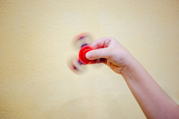 Fidget spinner in the child hand