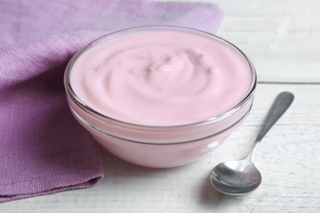 Yogurt, napkin and spoon