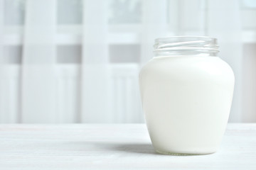 Obraz na płótnie Canvas A jar of yogurt