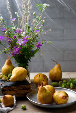 Autumn still life with pears and flowers